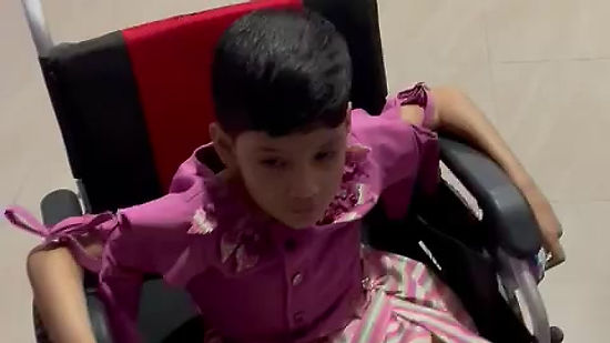 Specially Abled Child using Motorised Wheelchair